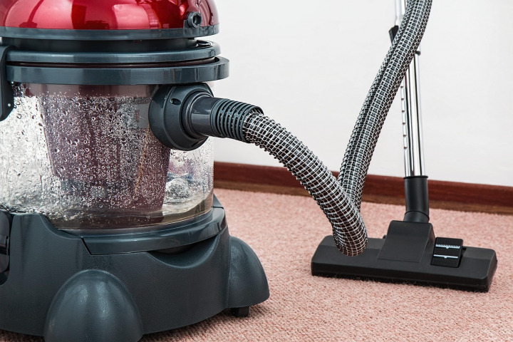 cleaning team vacuuming office